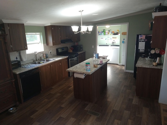 kitchen featuring a notable chandelier, exhaust hood, black appliances, sink, and decorative light fixtures