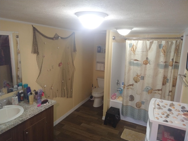 bathroom featuring wood-type flooring, a textured ceiling, toilet, and a shower with curtain