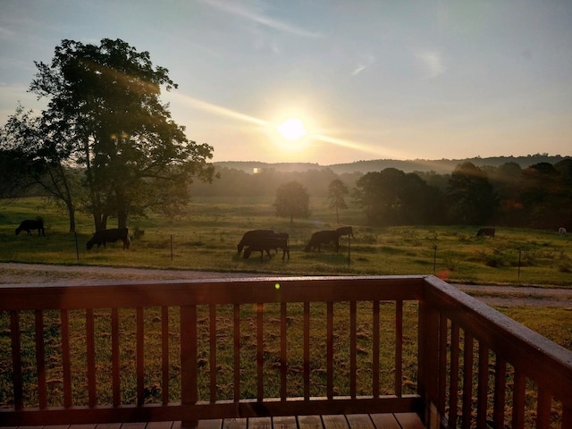 deck at dusk with a rural view