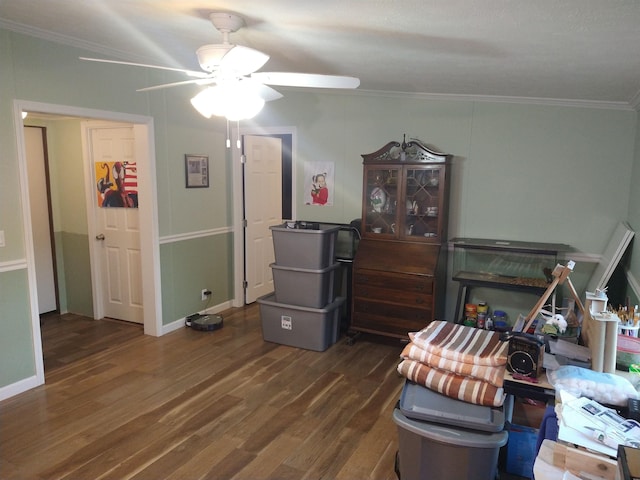 miscellaneous room with crown molding, ceiling fan, and dark hardwood / wood-style floors