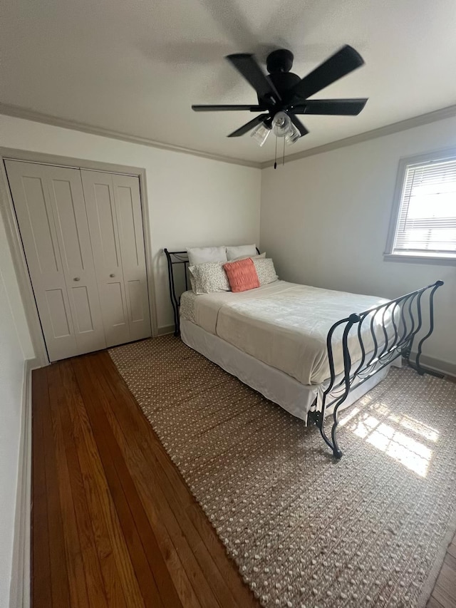  - bedroom with a closet, crown molding, ceiling fan, and baseboards