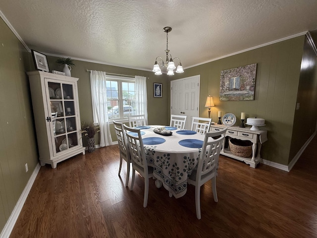  - dining area with wood finished floors, a chandelier, a textured ceiling, ornamental molding, and baseboards