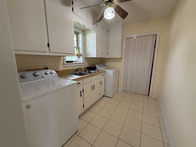  - clothes washing area featuring cabinet space, independent washer and dryer, ceiling fan, light tile patterned floors, and baseboards