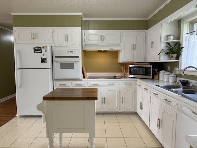  - kitchen with white appliances, wood counters, a sink, white cabinets, and open shelves
