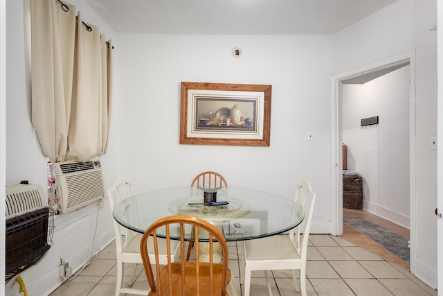  - dining area with light tile patterned floors and cooling unit