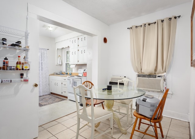  - dining area featuring cooling unit and light tile patterned floors