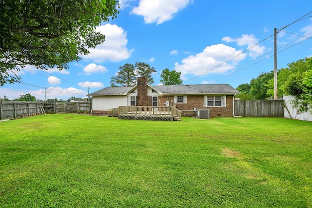  - back of property with cooling unit, a wooden deck, brick siding, and a chimney
