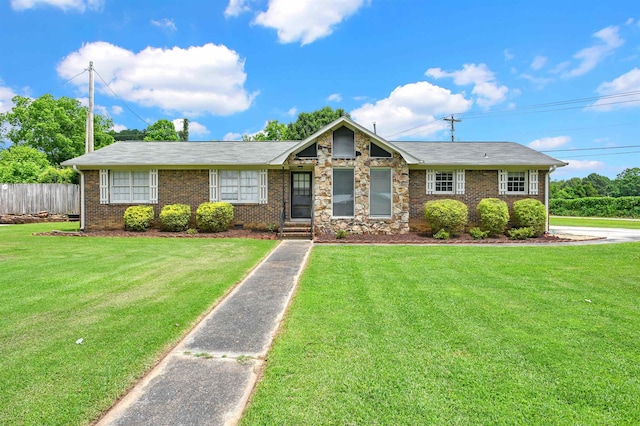 - view of front of house featuring brick siding