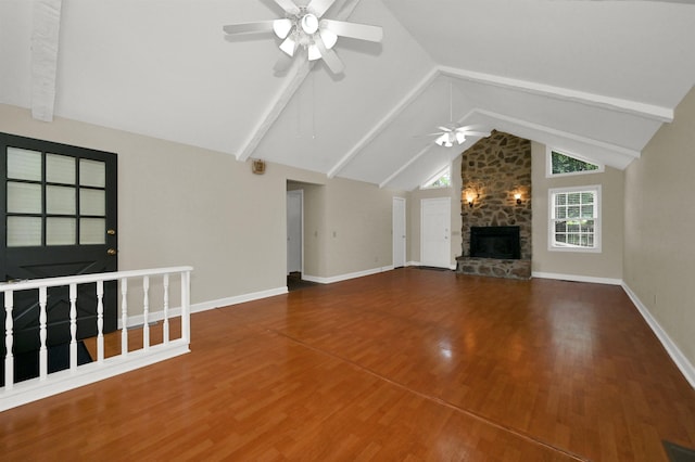  - unfurnished living room featuring a ceiling fan, a fireplace, wood finished floors, and baseboards