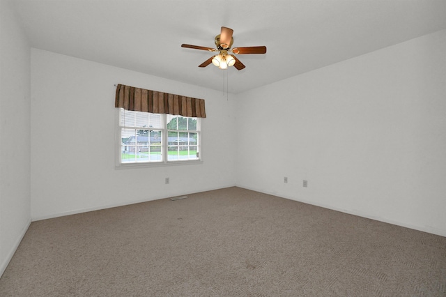  - empty room with carpet floors and a ceiling fan