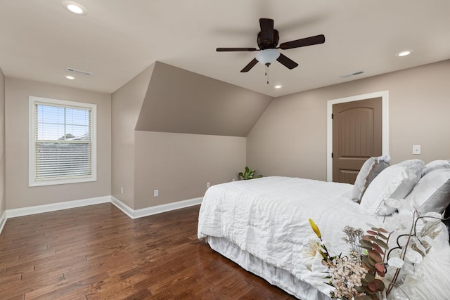 bedroom featuring visible vents, baseboards, lofted ceiling, recessed lighting, and wood finished floors