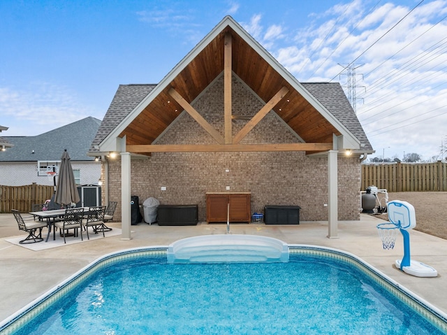 view of pool featuring a fenced in pool, fence, and a patio area