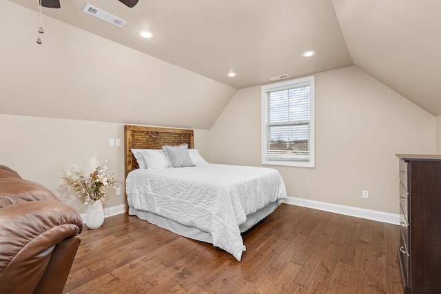 bedroom featuring visible vents, baseboards, lofted ceiling, recessed lighting, and dark wood-style floors