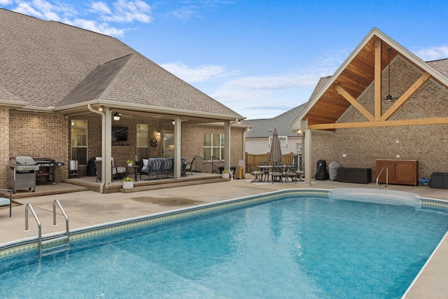 view of swimming pool featuring area for grilling, a ceiling fan, outdoor lounge area, a fenced in pool, and a patio area