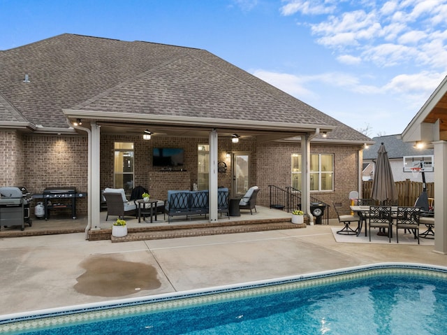 outdoor pool featuring a patio area, area for grilling, an outdoor hangout area, and ceiling fan