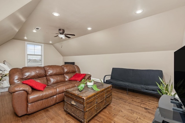 living area featuring lofted ceiling, light wood-style flooring, recessed lighting, and visible vents