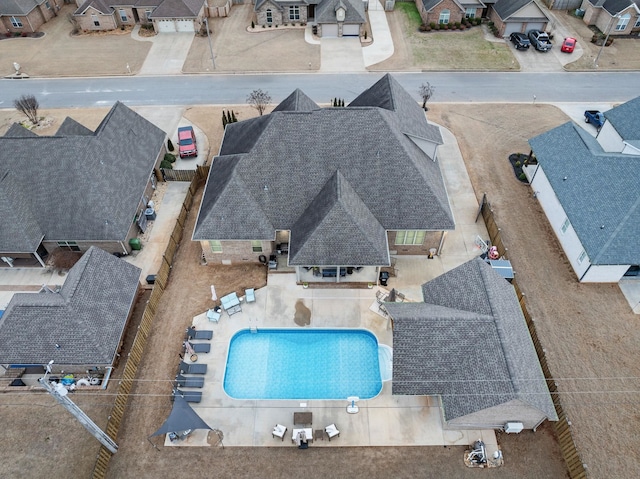 birds eye view of property with a residential view