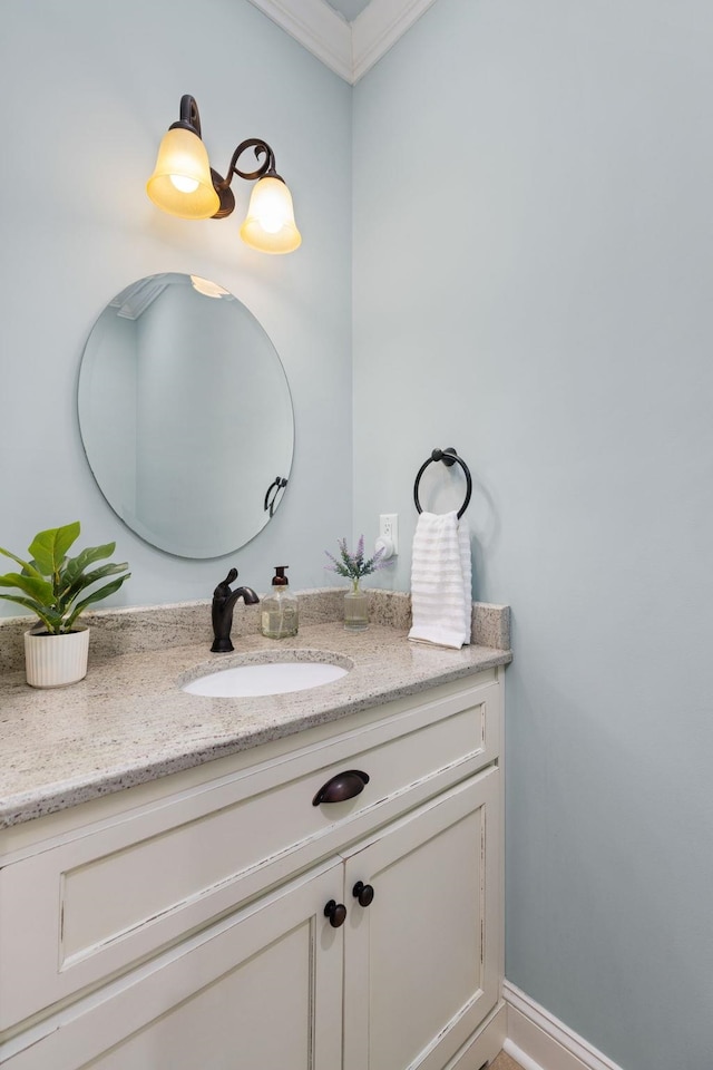 bathroom featuring vanity, baseboards, and ornamental molding