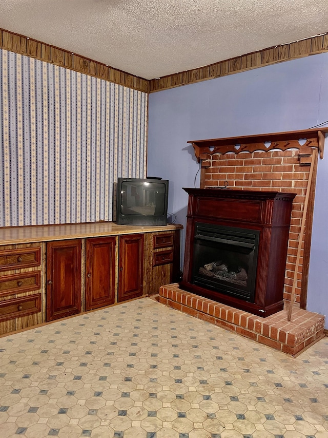 interior space featuring a fireplace and a textured ceiling