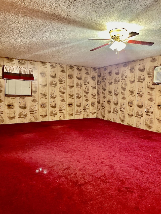 unfurnished room with ceiling fan, a textured ceiling, and a wall mounted AC