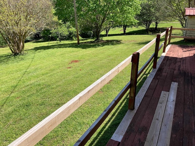 wooden terrace with a yard
