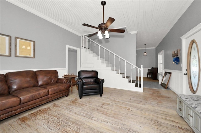 living room featuring ceiling fan, light hardwood / wood-style floors, and ornamental molding