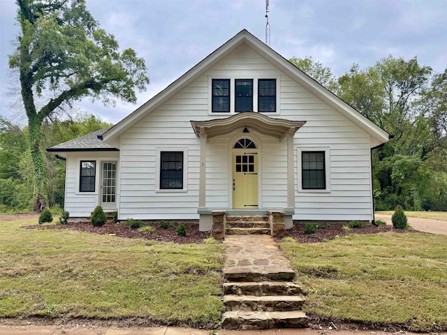 bungalow-style house with a front yard