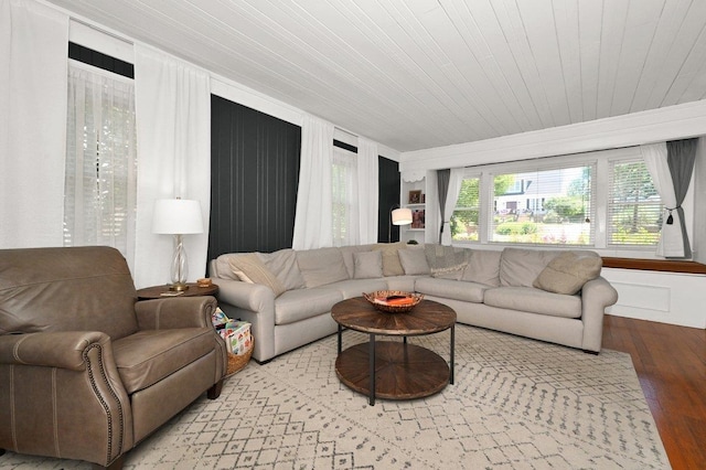 living room with light hardwood / wood-style floors and wooden ceiling