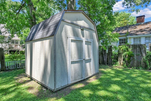 view of outdoor structure featuring a lawn