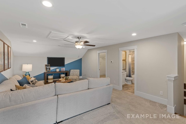 living room with ceiling fan, light colored carpet, and lofted ceiling