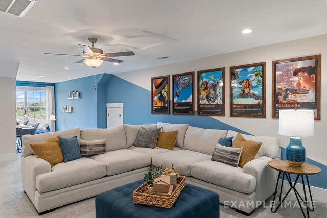 carpeted living room featuring ceiling fan