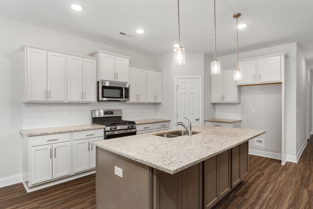 kitchen with appliances with stainless steel finishes, premium range hood, tasteful backsplash, dark brown cabinetry, and crown molding