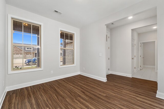 living room featuring a large fireplace, ceiling fan, light hardwood / wood-style floors, and wood walls