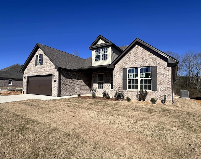 craftsman-style home with a front lawn, a garage, and cooling unit