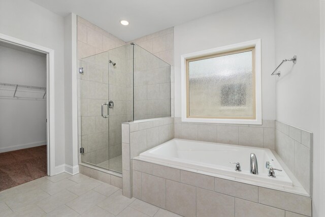 bedroom with dark hardwood / wood-style flooring, connected bathroom, ceiling fan, and wood walls