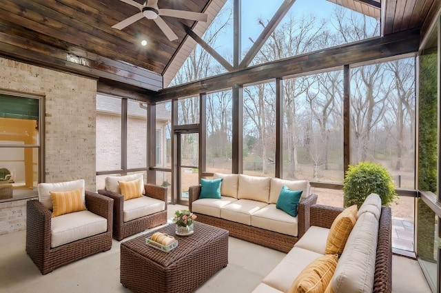 sunroom / solarium with ceiling fan, wooden ceiling, and a healthy amount of sunlight