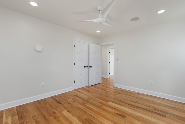 spare room with light wood-style flooring, baseboards, a ceiling fan, and recessed lighting