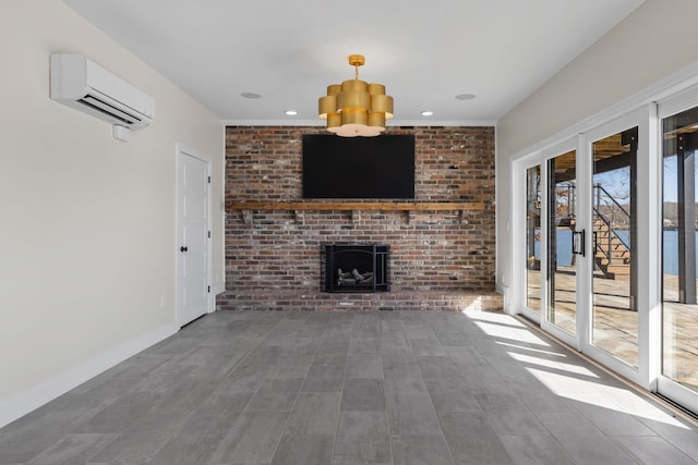 unfurnished living room with an AC wall unit, recessed lighting, a brick fireplace, and baseboards