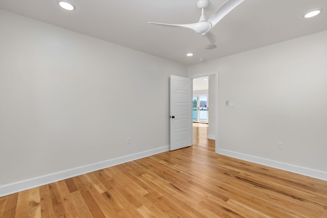 unfurnished room featuring recessed lighting, baseboards, a ceiling fan, and wood finished floors