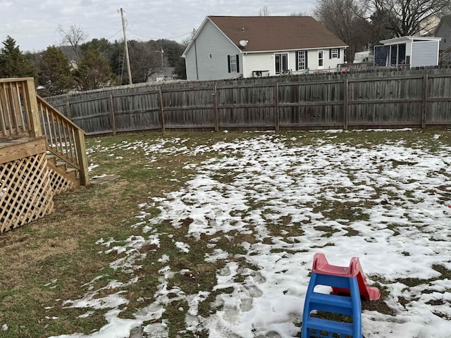 view of yard layered in snow