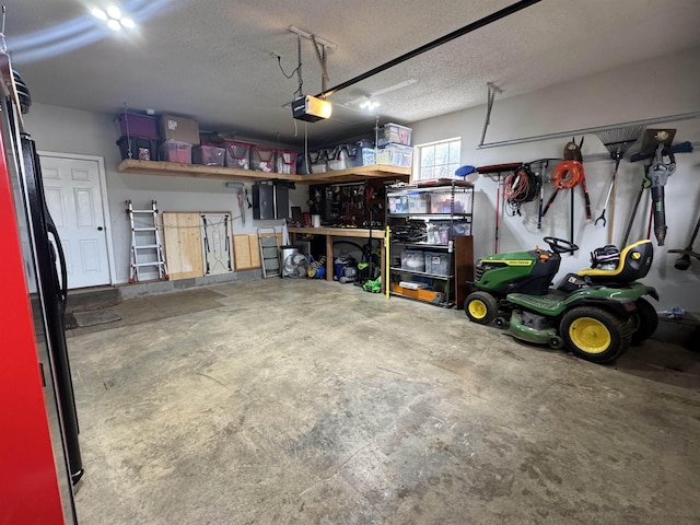 garage featuring a workshop area, stainless steel fridge, and a garage door opener