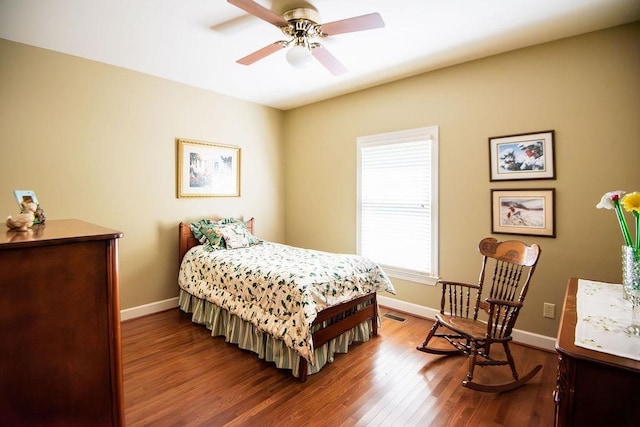  - bedroom featuring baseboards, wood finished floors, and a ceiling fan