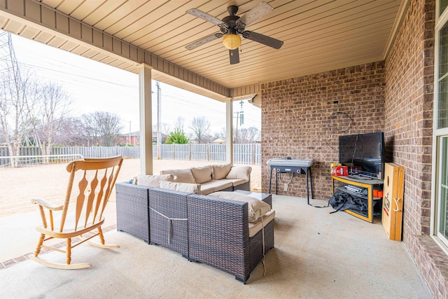 view of patio featuring ceiling fan and an outdoor living space