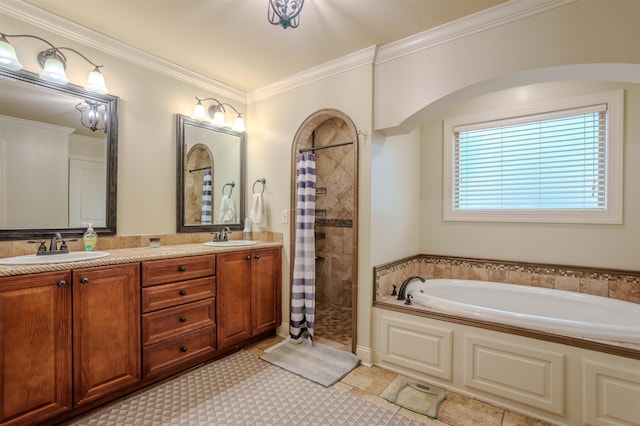 bathroom featuring independent shower and bath, ornamental molding, and vanity