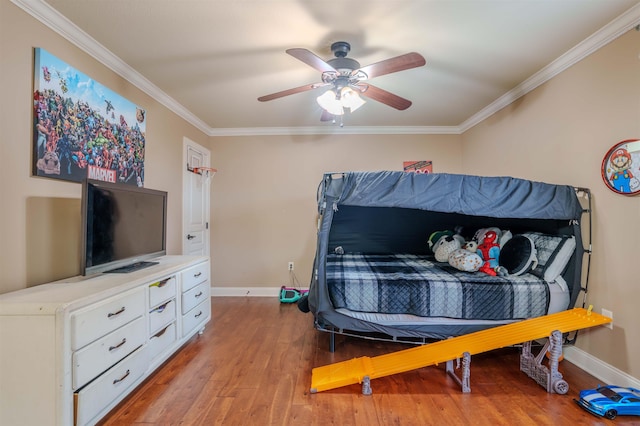 bedroom with crown molding, ceiling fan, and light hardwood / wood-style flooring