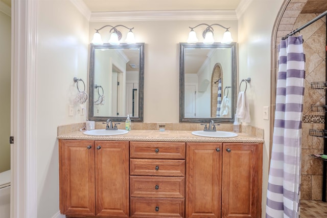 bathroom featuring ornamental molding, vanity, and a shower with curtain