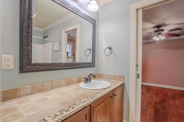  - full bath with crown molding, vanity, a ceiling fan, wood finished floors, and a shower