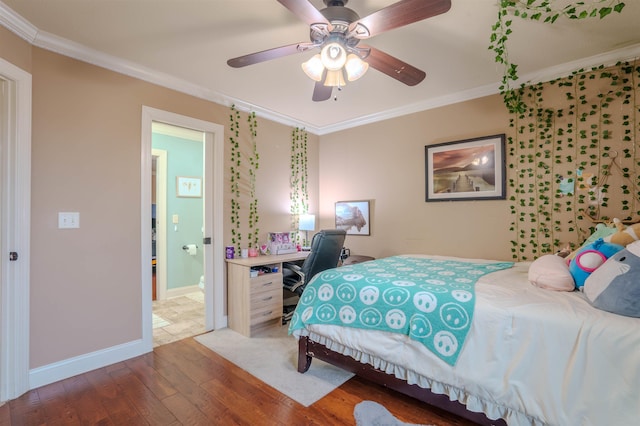 bedroom featuring ornamental molding, wood-type flooring, ensuite bathroom, and ceiling fan