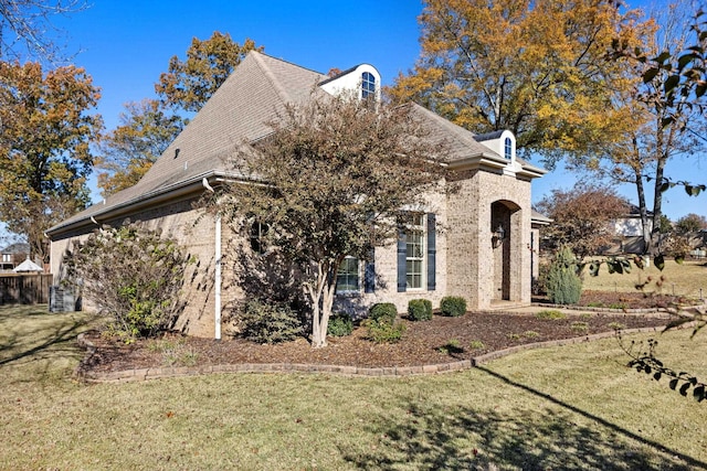 view of property exterior featuring a yard