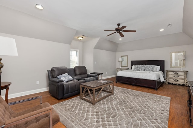 bedroom featuring hardwood / wood-style floors, ceiling fan, and vaulted ceiling